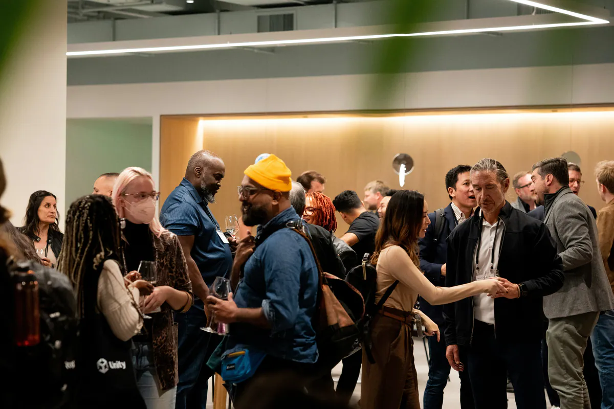People talking and building connections at a professional event.